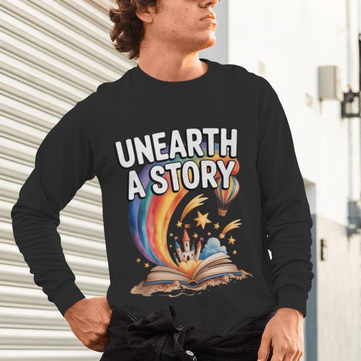 Unearth A Story Rainbow Treasure Book Unisex Long Sleeve T-Shirt Unearth A Story Rainbow Treasure Book Unisex Long Sleeve T-Shirt