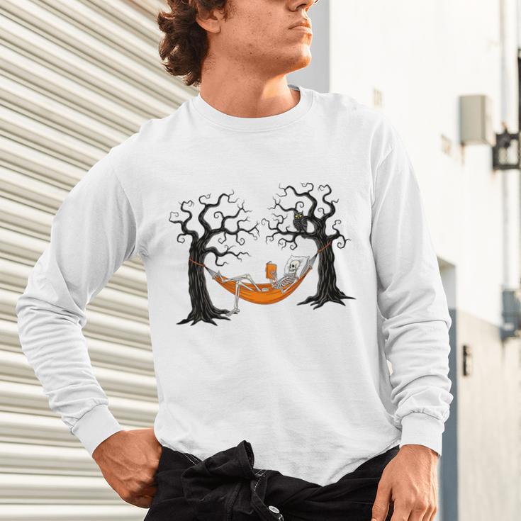 Skeleton Reading Book In Hammock Halloween Reader Unisex Long Sleeve T-Shirt Skeleton Reading Book In Hammock Halloween Reader Unisex Long Sleeve T-Shirt