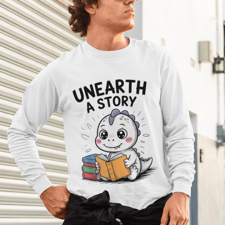 Unearth a Story Cute Dinosaur Summer Reading 2026 Dino Book Unisex Long Sleeve T-Shirt