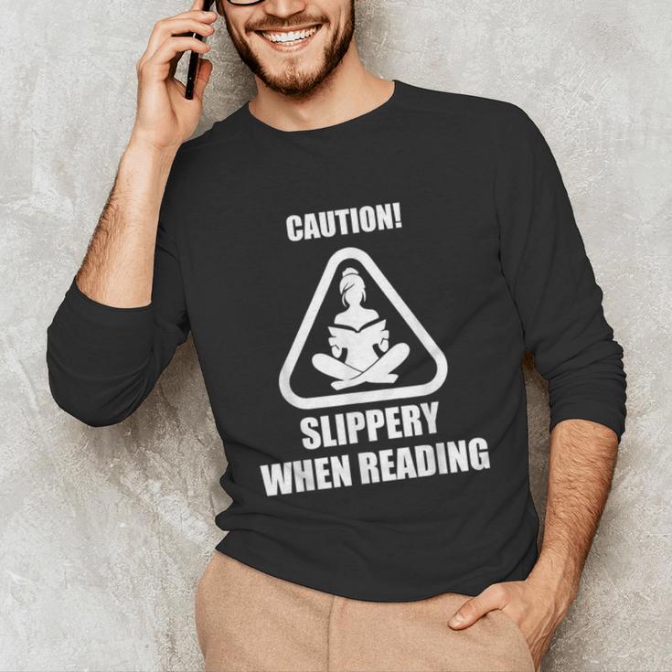 Caution Slippery When Reading Book Lover Unisex Long Sleeve T-Shirt Caution Slippery When Reading Book Lover Unisex Long Sleeve T-Shirt