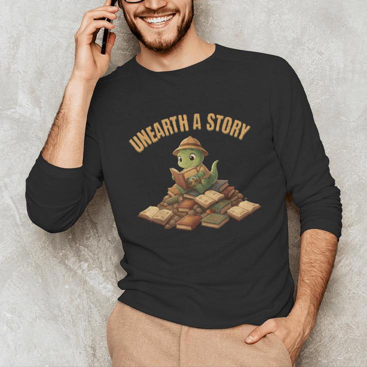 Unearth a Story Dinosaur Reading Books Summer 2026 Unisex Long Sleeve T-Shirt