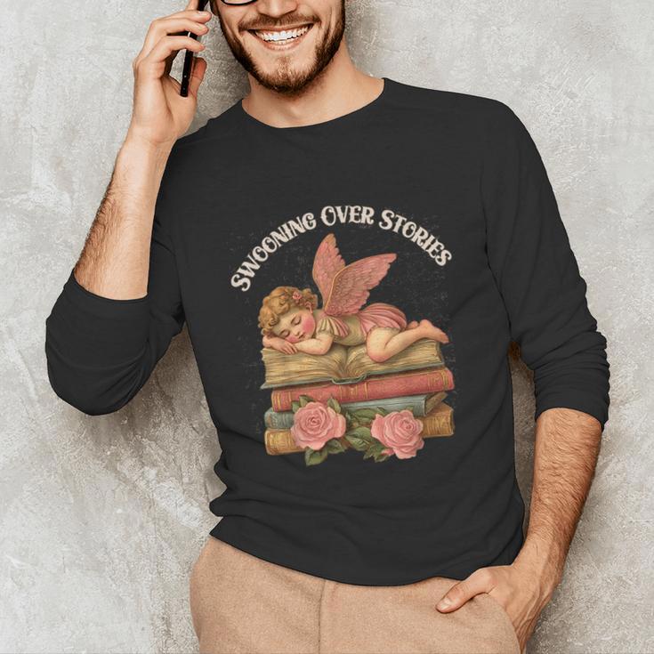 Valentine's Swooning Over Stories Cupid And Book Lover Tee Unisex Long Sleeve T-Shirt Valentine's Swooning Over Stories Cupid And Book Lover Tee Unisex Long Sleeve T-Shirt