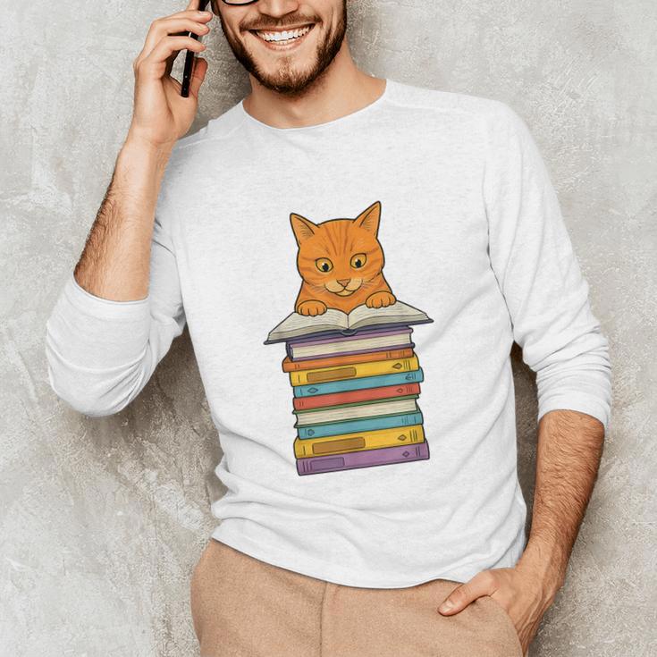 Cute Orange Tabby Cat Reading On Pile Of Books Unisex Long Sleeve T-Shirt Cute Orange Tabby Cat Reading On Pile Of Books Unisex Long Sleeve T-Shirt