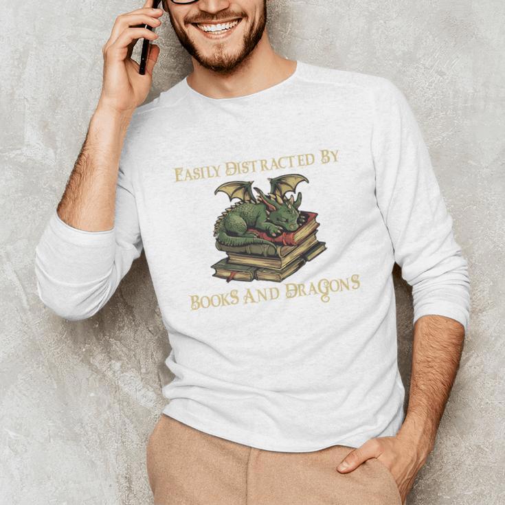 Easily Distracted By Books And Dragons Graphic Premium Unisex Long Sleeve T-Shirt Easily Distracted By Books And Dragons Graphic Premium Unisex Long Sleeve T-Shirt