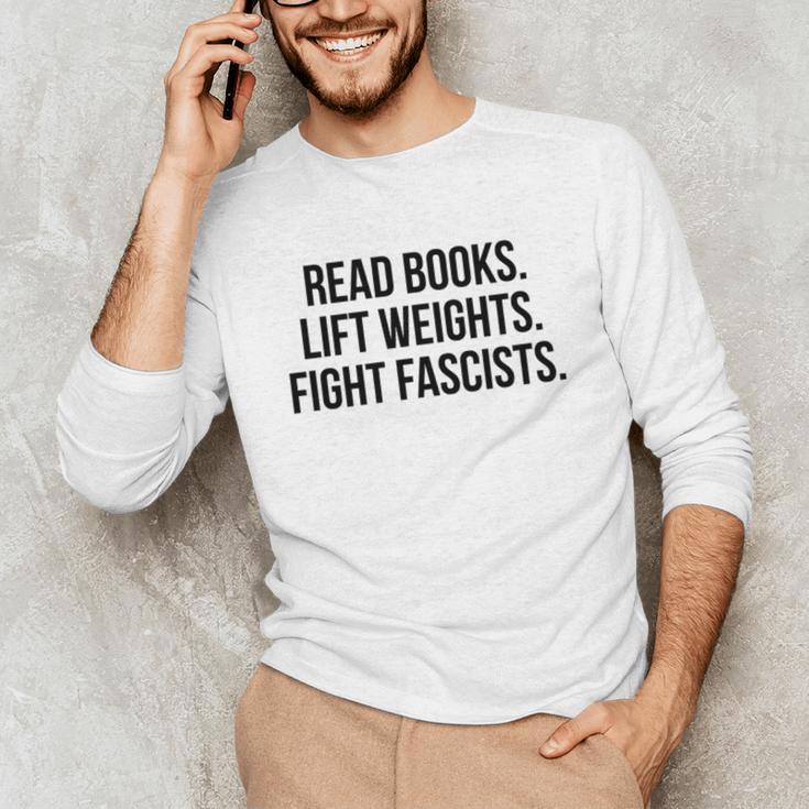 Read Books Lift Weights Fight Fascists Premium Tri-Blend Unisex Long Sleeve T-Shirt