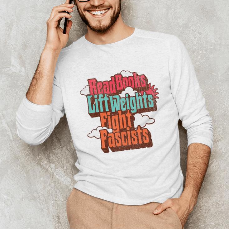 Read Books Lift Weights Fight Fascists Reading No Kings Premium Tri-Blend Unisex Long Sleeve T-Shirt