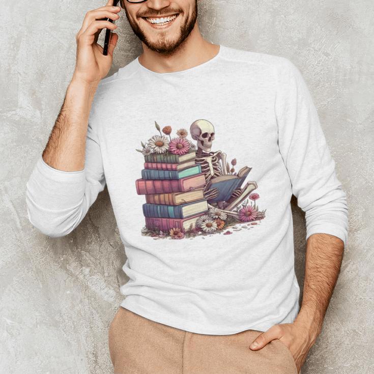 Reading A Book Per Day Keeps Reality Away Skeleton Books Unisex Long Sleeve T-Shirt Reading A Book Per Day Keeps Reality Away Skeleton Books Unisex Long Sleeve T-Shirt