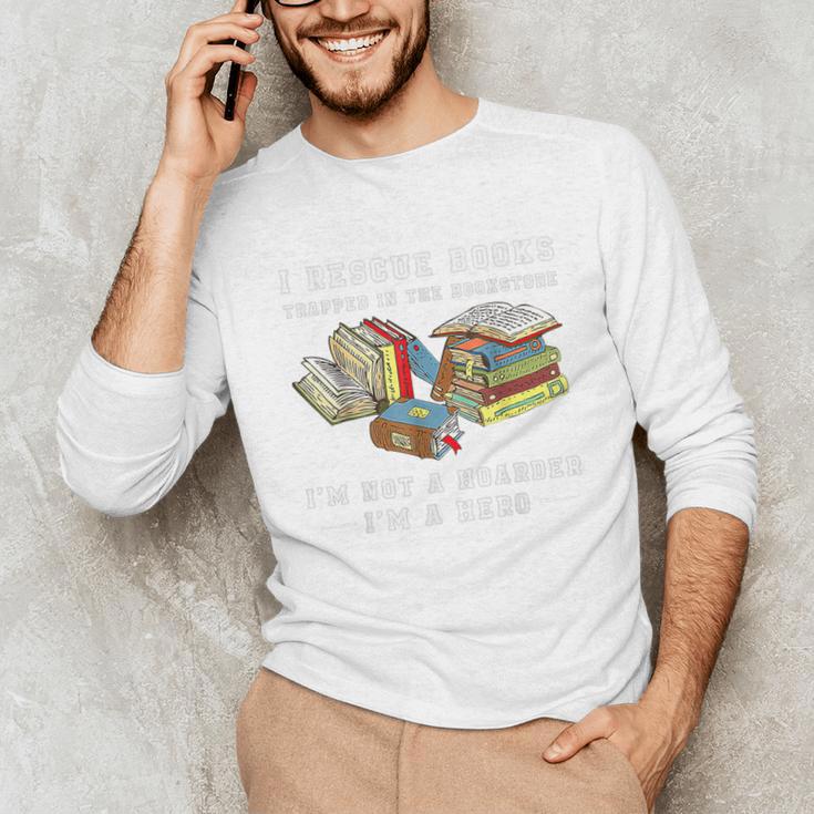 I Rescue Book Trapped In The Bookstore I'm Not A Hoarder Premium Tri-Blend Unisex Long Sleeve T-Shirt I Rescue Book Trapped In The Bookstore I'm Not A Hoarder Premium Tri-Blend Unisex Long Sleeve T-Shirt