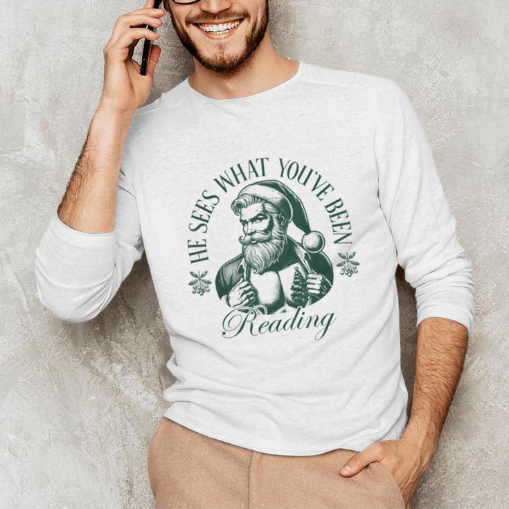 He Sees What You'Ve Been Reading Bookish Christmas Unisex Long Sleeve T-Shirt He Sees What You'Ve Been Reading Bookish Christmas Unisex Long Sleeve T-Shirt