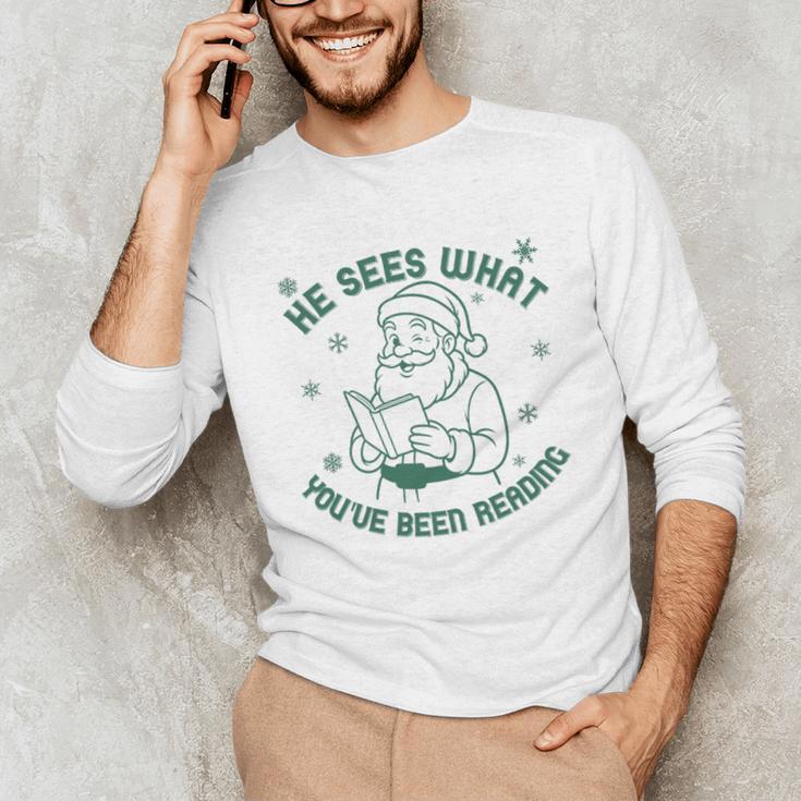 He Sees What You'Ve Been Reading Christmas Bookish Santa Premium Tri-Blend Unisex Long Sleeve T-Shirt
