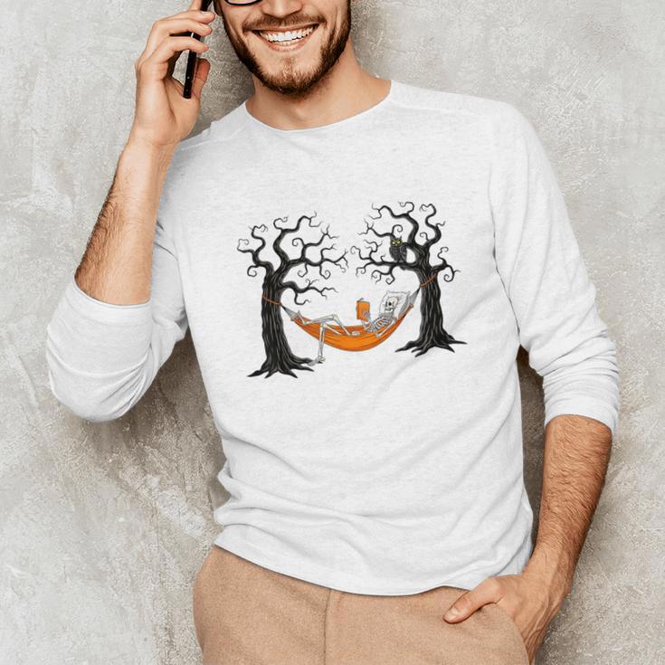 Skeleton Reading Book In Hammock Halloween Reader Unisex Long Sleeve T-Shirt Skeleton Reading Book In Hammock Halloween Reader Unisex Long Sleeve T-Shirt