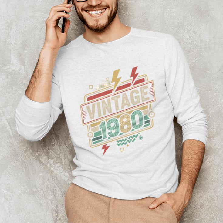 Vintage 1980 Retro Badge Decade Nostalgia Graphic Emblem Premium Tri-Blend Unisex Long Sleeve T-Shirt