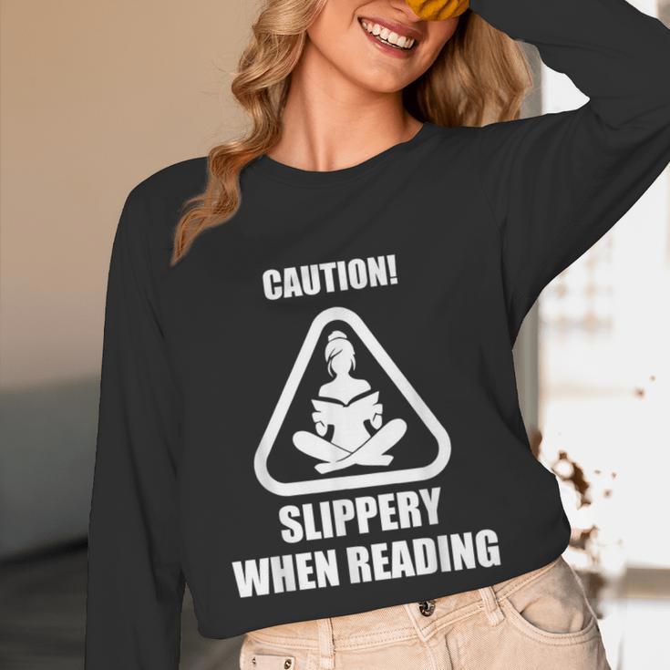 Caution Slippery When Reading Book Lover Unisex Long Sleeve T-Shirt Caution Slippery When Reading Book Lover Unisex Long Sleeve T-Shirt