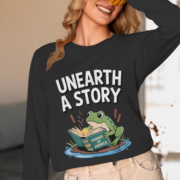 Unearth a Story Frog Reading a Book Summer 2026 Unisex Long Sleeve T-Shirt Unearth a Story Frog Reading a Book Summer 2026 Unisex Long Sleeve T-Shirt