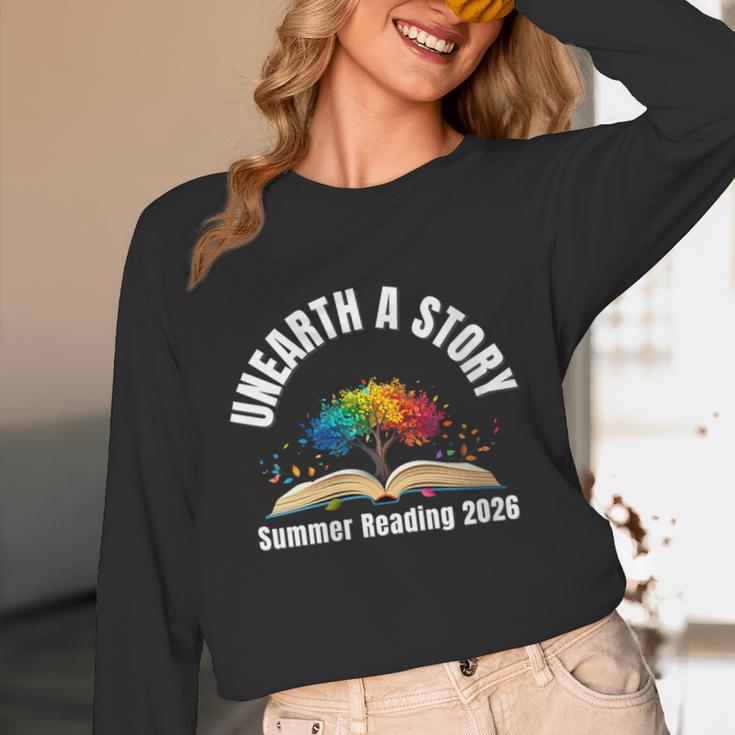Women's Unearth a Story 2026 Summer Reading Program Tree Book Unisex Long Sleeve T-Shirt Women's Unearth a Story 2026 Summer Reading Program Tree Book Unisex Long Sleeve T-Shirt