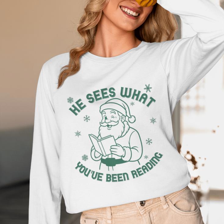 He Sees What You'Ve Been Reading Christmas Bookish Santa Premium Tri-Blend Unisex Long Sleeve T-Shirt