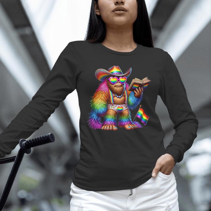 Rainbow Pride Bigfoot Reading Book With Heart Glasses Unisex Long Sleeve T-Shirt Rainbow Pride Bigfoot Reading Book With Heart Glasses Unisex Long Sleeve T-Shirt