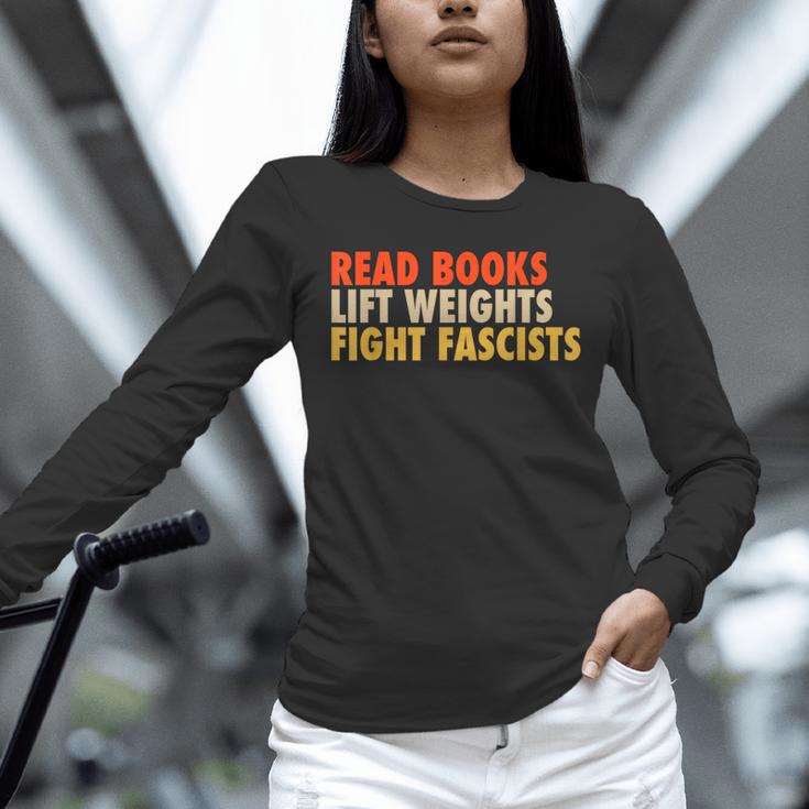 Read Books Lift Weights Fight Fascists Reading Humor Unisex Long Sleeve T-Shirt Read Books Lift Weights Fight Fascists Reading Humor Unisex Long Sleeve T-Shirt