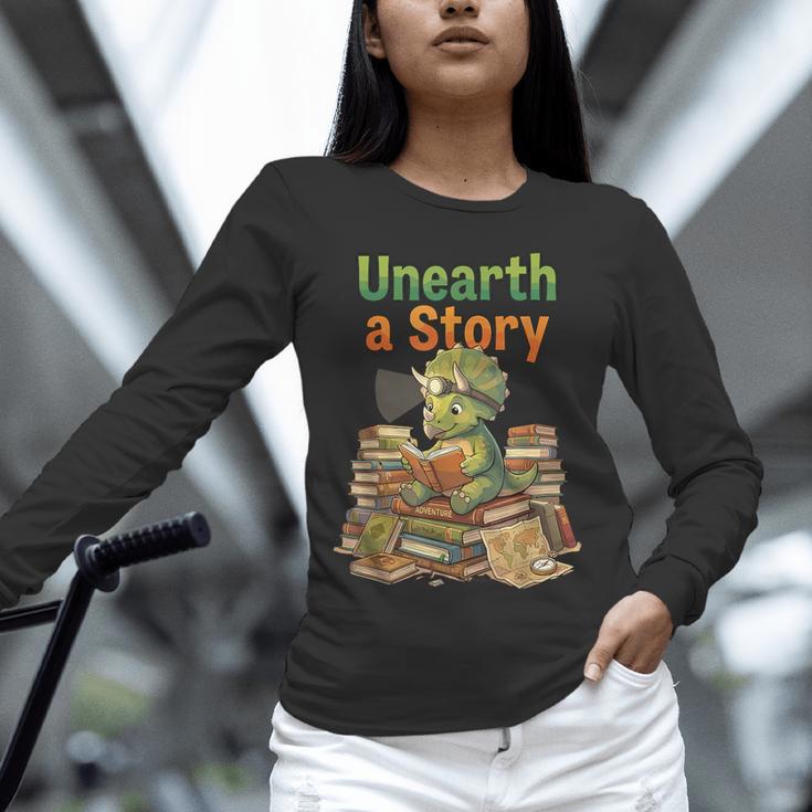 Unearth a Story Triceratops Dinosaur Reading Books Cute Dino Unisex Long Sleeve T-Shirt Unearth a Story Triceratops Dinosaur Reading Books Cute Dino Unisex Long Sleeve T-Shirt