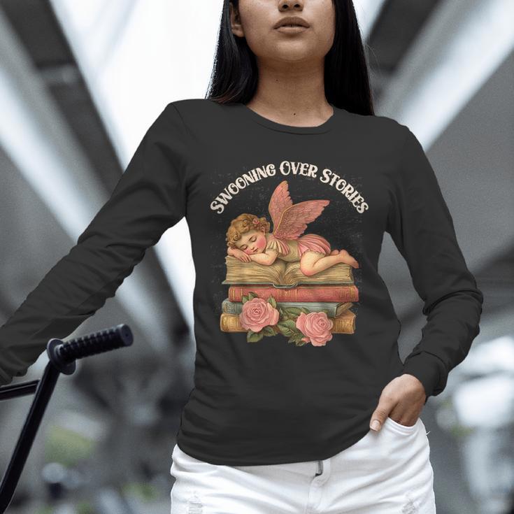 Valentine's Swooning Over Stories Cupid And Book Lover Tee Unisex Long Sleeve T-Shirt Valentine's Swooning Over Stories Cupid And Book Lover Tee Unisex Long Sleeve T-Shirt