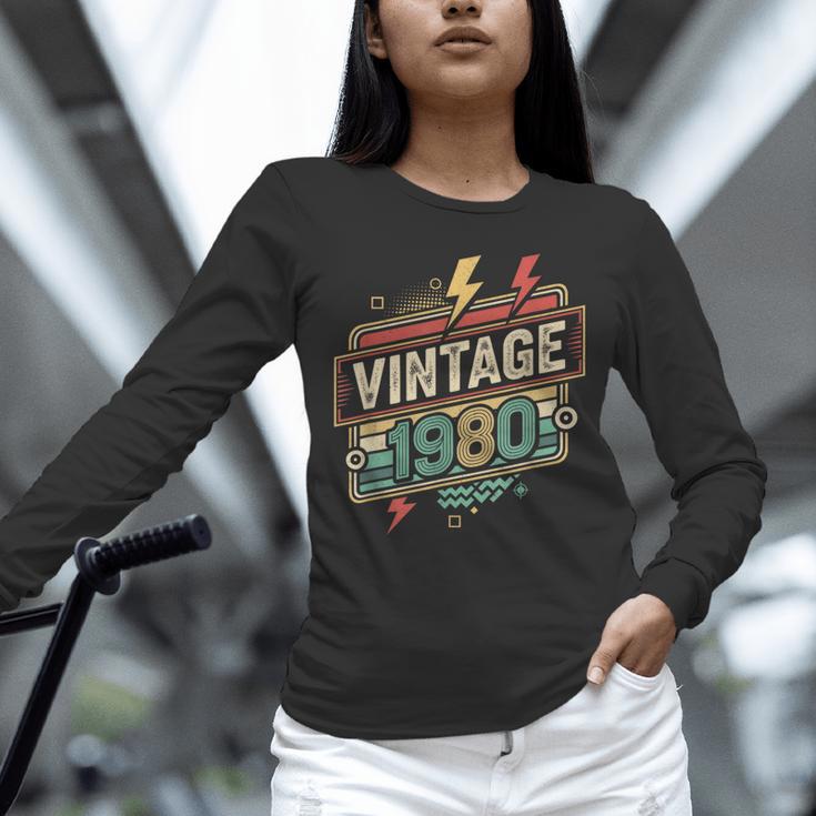 Vintage 1980 Retro Badge Decade Nostalgia Graphic Emblem Unisex Long Sleeve T-Shirt Vintage 1980 Retro Badge Decade Nostalgia Graphic Emblem Unisex Long Sleeve T-Shirt