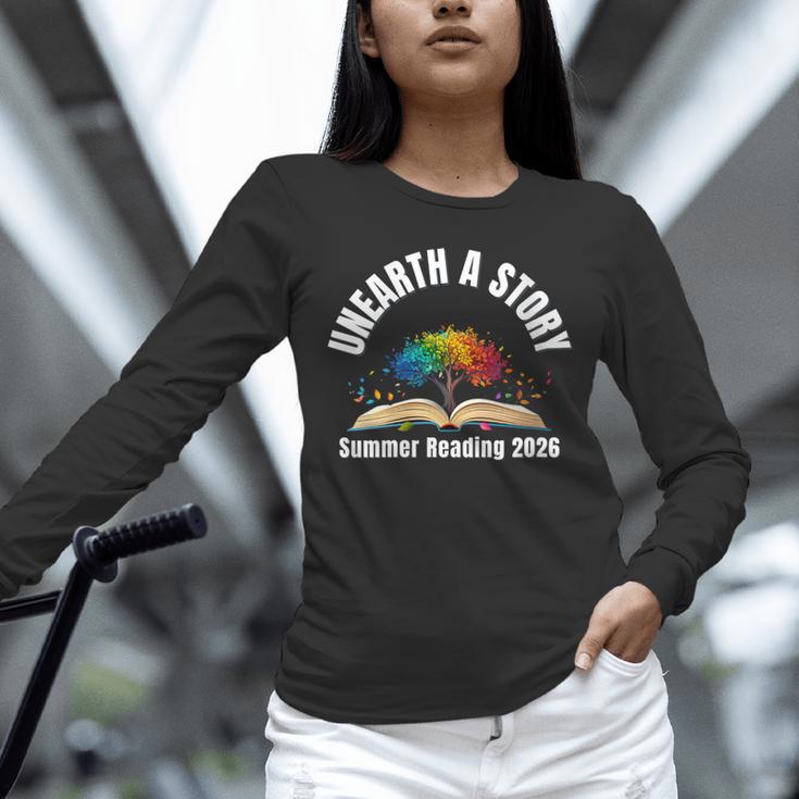 Women's Unearth a Story 2026 Summer Reading Program Tree Book Unisex Long Sleeve T-Shirt Women's Unearth a Story 2026 Summer Reading Program Tree Book Unisex Long Sleeve T-Shirt