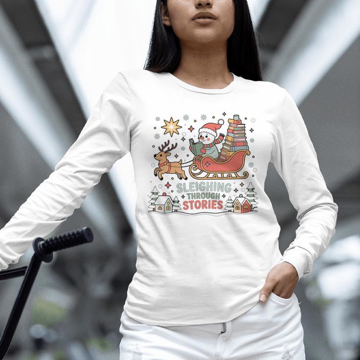 Book Lovers Winter Sleighing Through Stories Tee Premium Tri-Blend Unisex Long Sleeve T-Shirt
