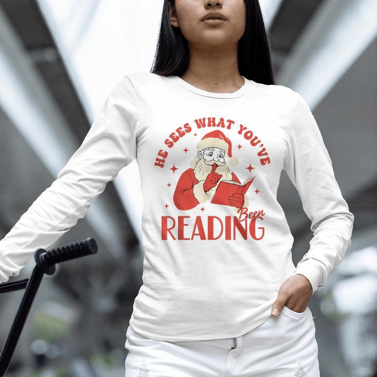 He Sees What You'Ve Been Reading Santa Book Unisex Long Sleeve T-Shirt He Sees What You'Ve Been Reading Santa Book Unisex Long Sleeve T-Shirt