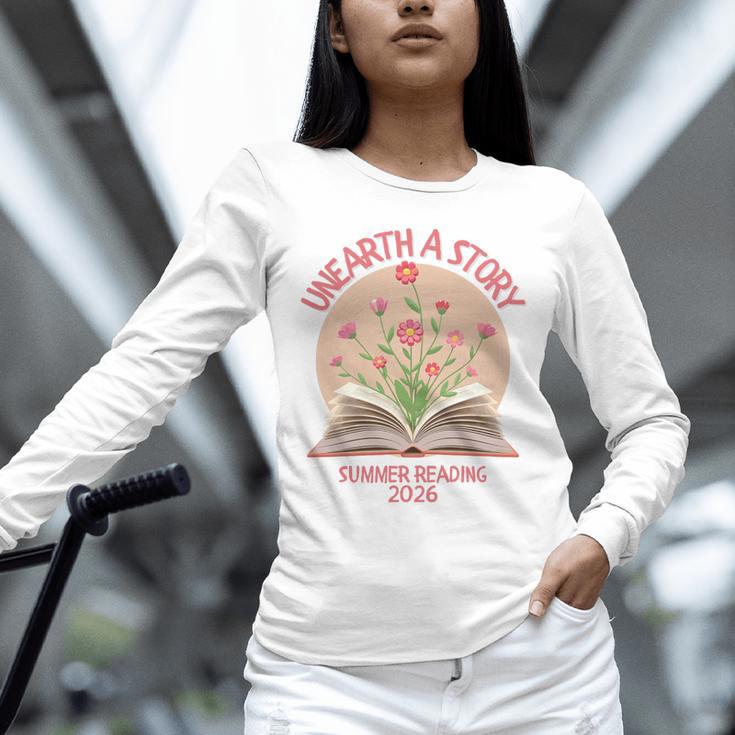 Unearth a Story 2026 Summer Reading Program Flowers Book Premium Tri-Blend Unisex Long Sleeve T-Shirt Unearth a Story 2026 Summer Reading Program Flowers Book Premium Tri-Blend Unisex Long Sleeve T-Shirt