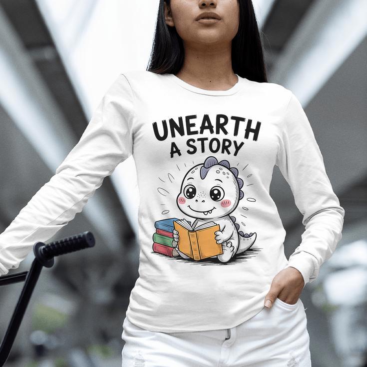 Unearth a Story Cute Dinosaur Summer Reading 2026 Dino Book Unisex Long Sleeve T-Shirt