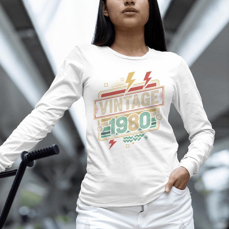 Vintage 1980 Retro Badge Decade Nostalgia Graphic Emblem Premium Tri-Blend Unisex Long Sleeve T-Shirt