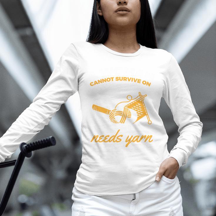 Woman Survives On Books Yarn Knitting Crochet Premium Tri-Blend Unisex Long Sleeve T-Shirt Woman Survives On Books Yarn Knitting Crochet Premium Tri-Blend Unisex Long Sleeve T-Shirt