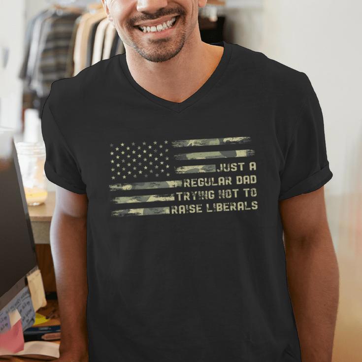 Just a Regular Dad Trying Not To Raise Liberals Camouflage Men's V-Neck T-Shirt