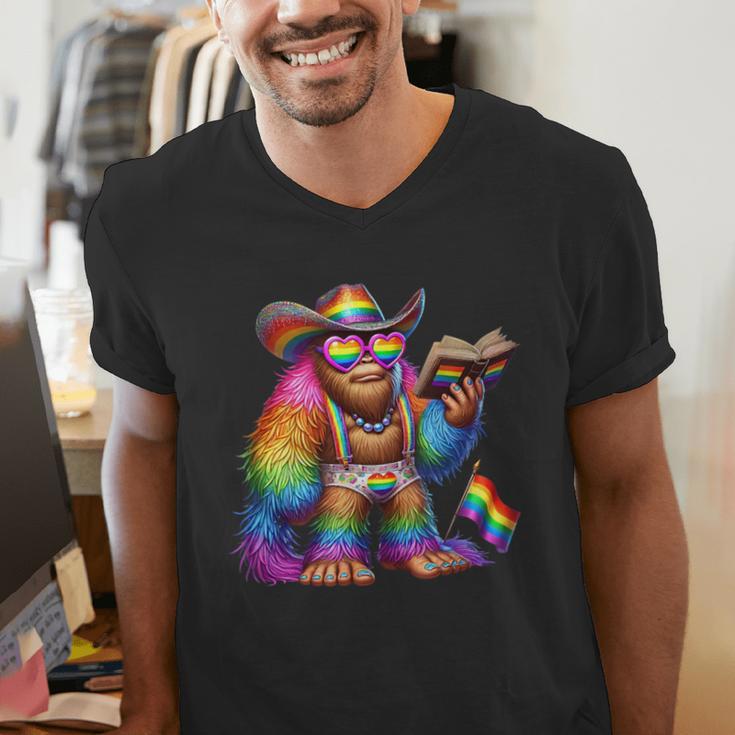Rainbow Pride Bigfoot Reading Book With Heart Glasses Men's V-Neck T-Shirt Rainbow Pride Bigfoot Reading Book With Heart Glasses Men's V-Neck T-Shirt