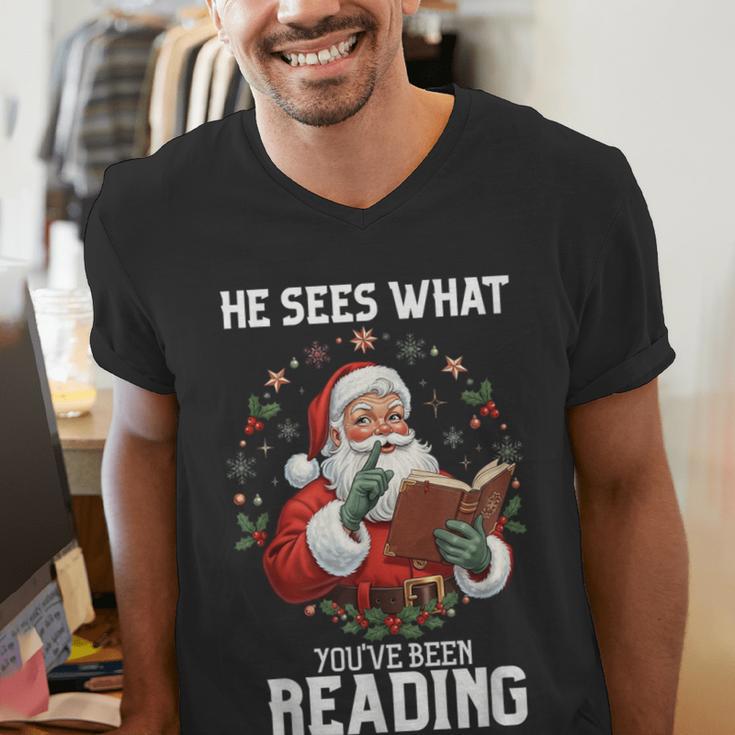 He Sees What You'Ve Been Reading Santa Book Lover Men's V-Neck T-Shirt He Sees What You'Ve Been Reading Santa Book Lover Men's V-Neck T-Shirt