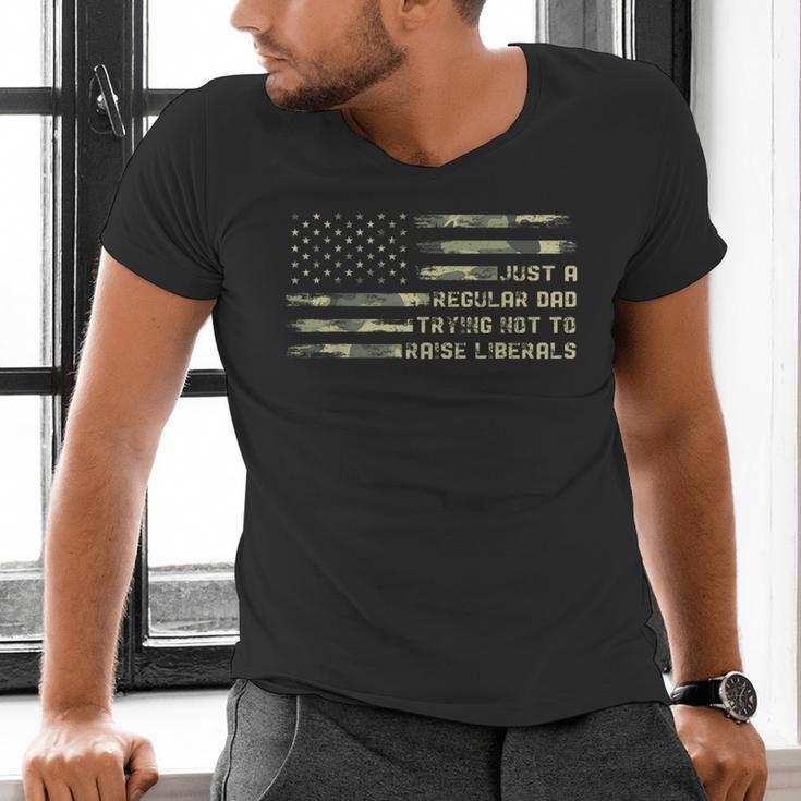Just a Regular Dad Trying Not To Raise Liberals Camouflage Men's V-Neck T-Shirt