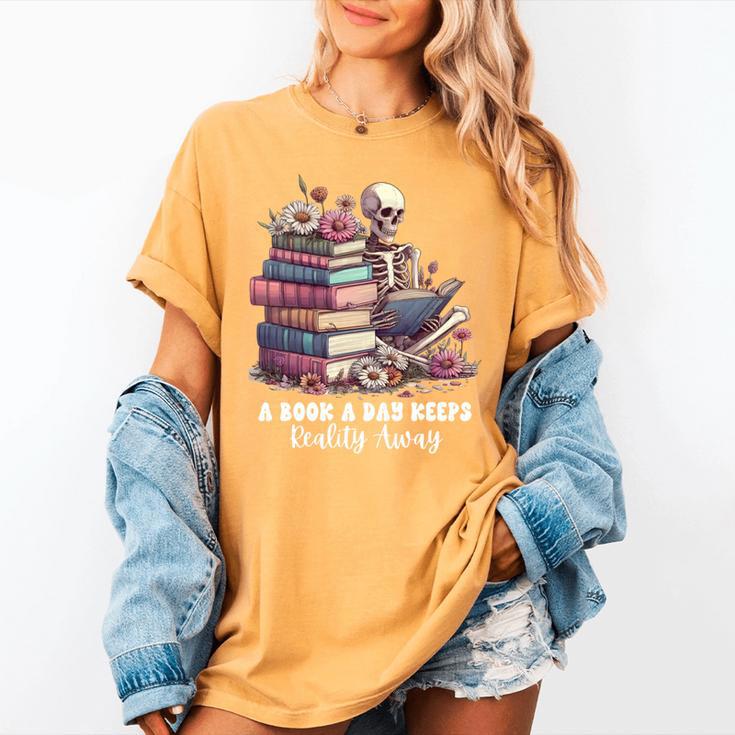 Reading A Book Per Day Keeps Reality Away Skeleton Books Women's Comfort Colors T-Shirt Reading A Book Per Day Keeps Reality Away Skeleton Books Women's Comfort Colors T-Shirt