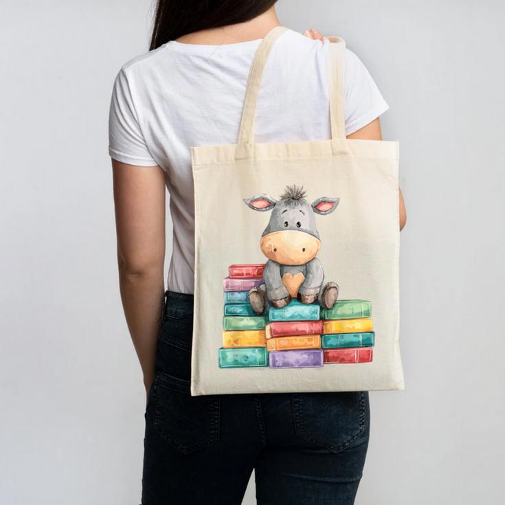 Adorable Donkey With Heart Sitting On Colorful Book Stack Canvas Tote Bag