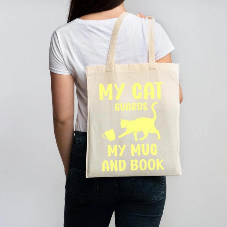 My Cat Guards My Mug And Book Humor Cats Premium Tri-Blend Canvas Tote Bag