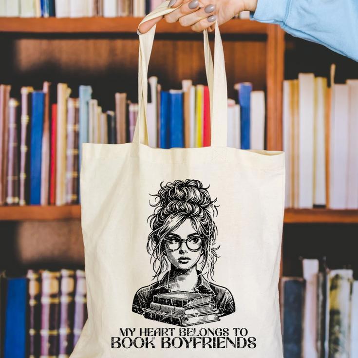 Book Lover Bent Over a Book Canvas Tote Bag