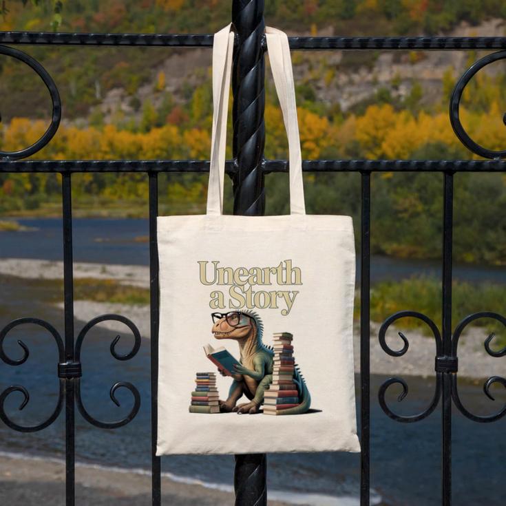 Unearth A Story Dinosaur Reading a Library Book Canvas Tote Bag