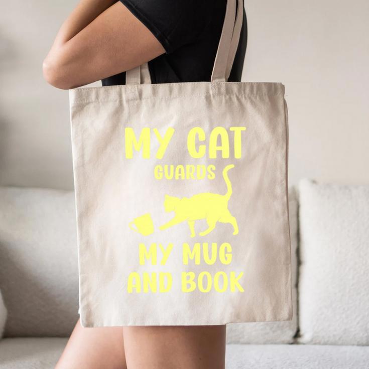 My Cat Guards My Mug And Book Humor Cats Premium Tri-Blend Canvas Tote Bag My Cat Guards My Mug And Book Humor Cats Premium Tri-Blend Canvas Tote Bag