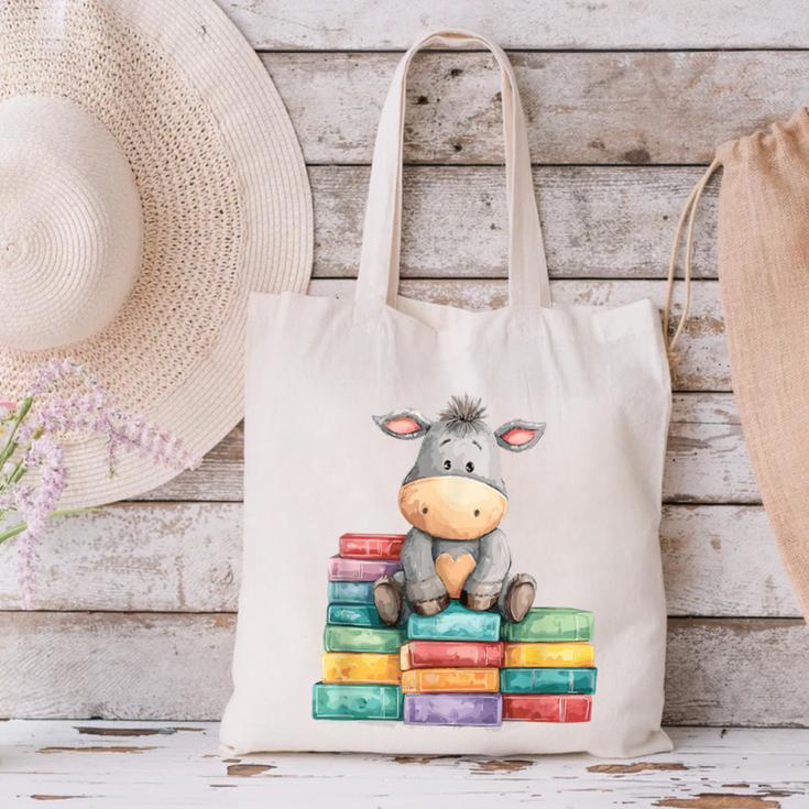 Adorable Donkey With Heart Sitting On Colorful Book Stack Canvas Tote Bag