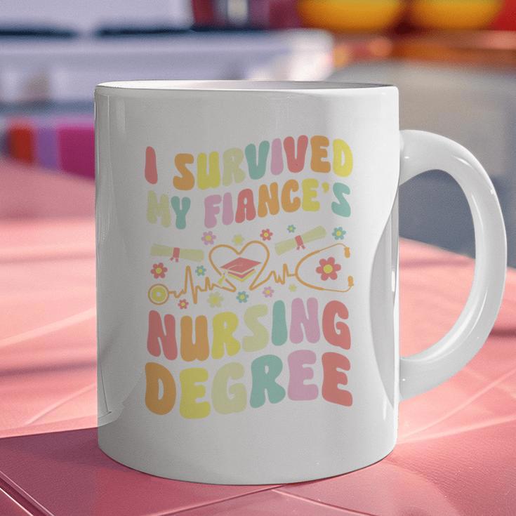 i Survived My Fiance's Nursing Degree Graduation Groovy Premium Graphic Print Coffee Mug