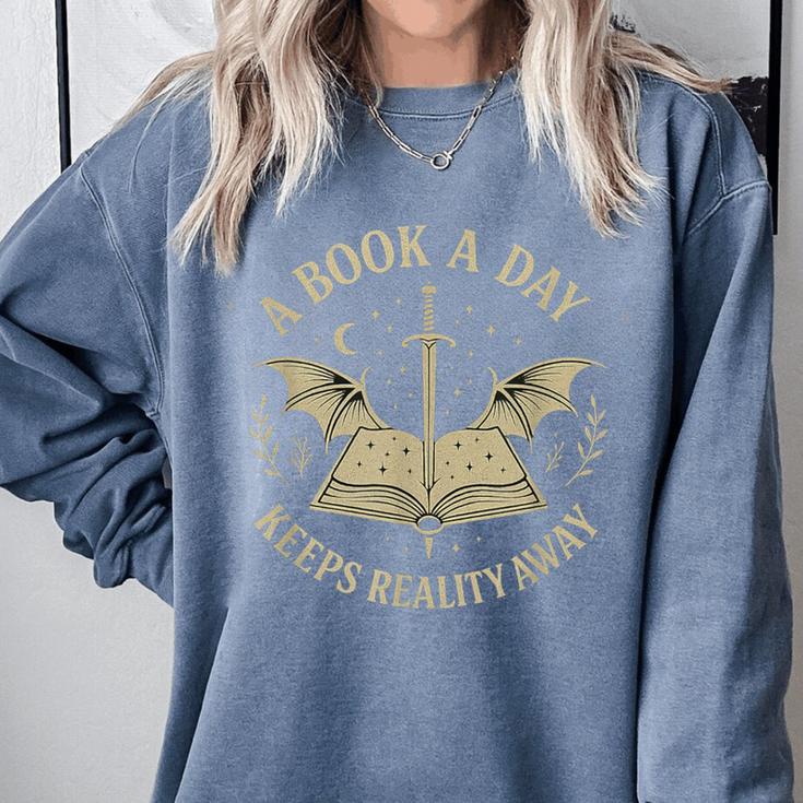 A Book A Day Keeps Reality Away Reading Escape Quote Comfort Colors Sweatshirt A Book A Day Keeps Reality Away Reading Escape Quote Comfort Colors Sweatshirt