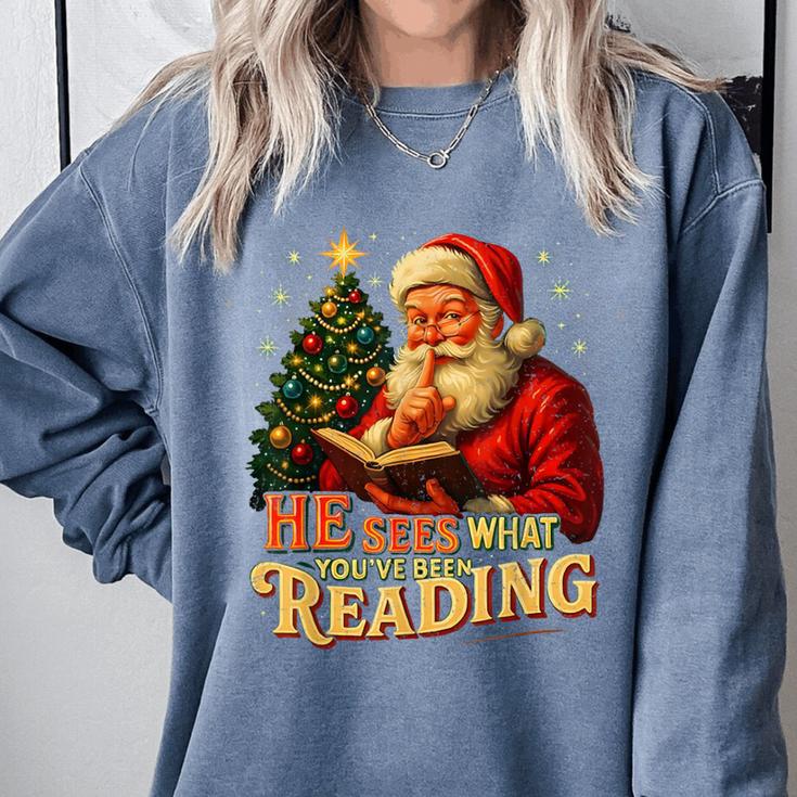 He Sees What You’Ve Been Reading Santa Book Lover Christmas Comfort Colors Sweatshirt