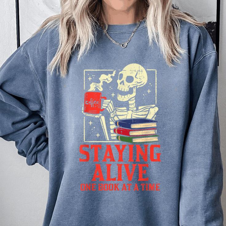 Staying Alive One Book At A Time Skeleton Reading Librarian Comfort Colors Sweatshirt