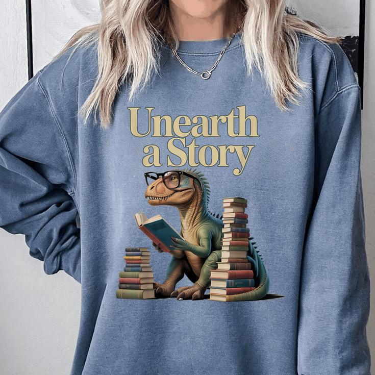 Unearth A Story Dinosaur Reading a Library Book Comfort Colors Sweatshirt Unearth A Story Dinosaur Reading a Library Book Comfort Colors Sweatshirt