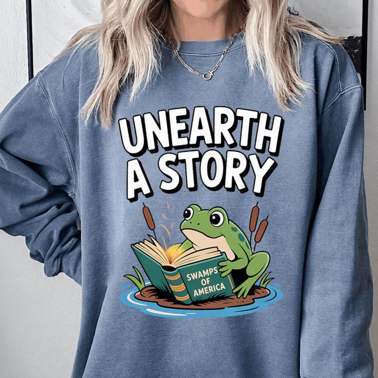 Unearth a Story Frog Reading a Book Summer 2026 Premium Tri-Blend Comfort Colors Sweatshirt Unearth a Story Frog Reading a Book Summer 2026 Premium Tri-Blend Comfort Colors Sweatshirt