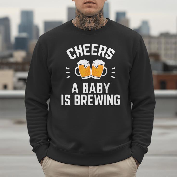 New Dad Baby Shower Cheers A Baby Is Brewing Men Sweatshirt New Dad Baby Shower Cheers A Baby Is Brewing Men Sweatshirt